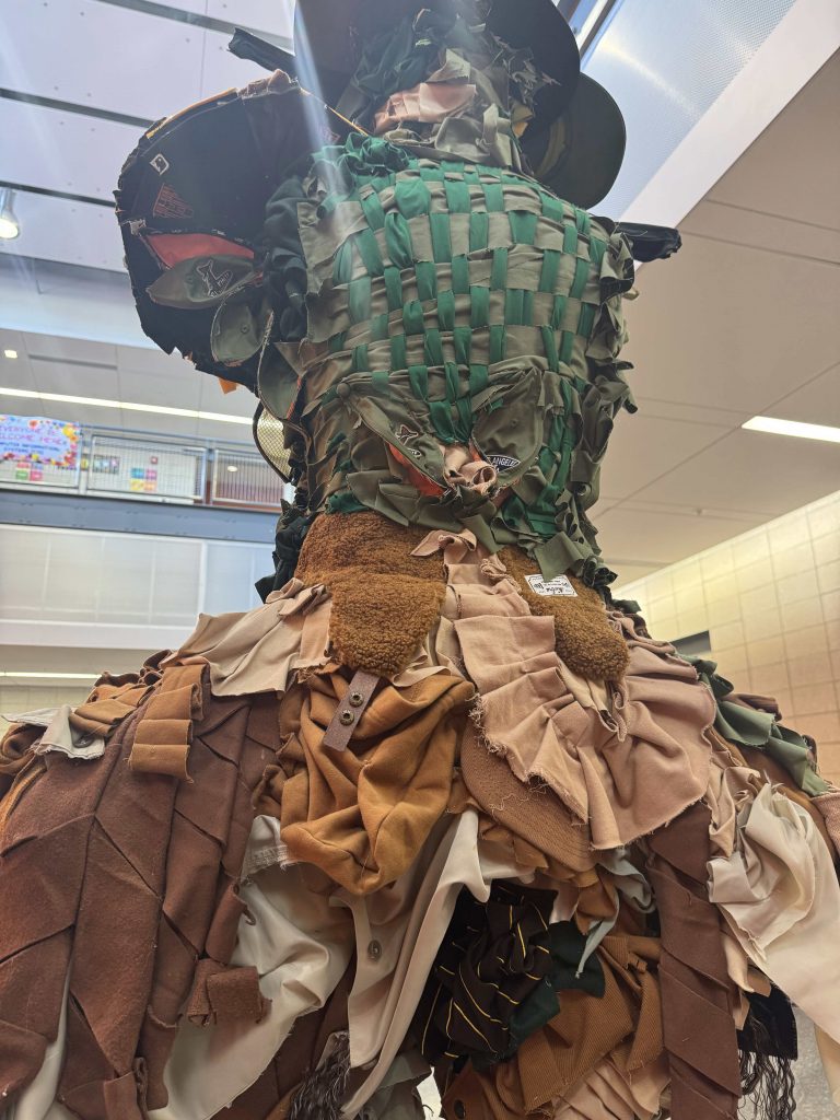 Closer view of the back of the sculpture, waist level to the back of the head.