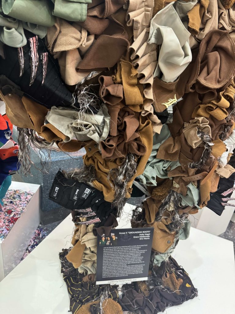 Close up view on the front of the sculpture's lower body featuring the roots and thorns/scars.